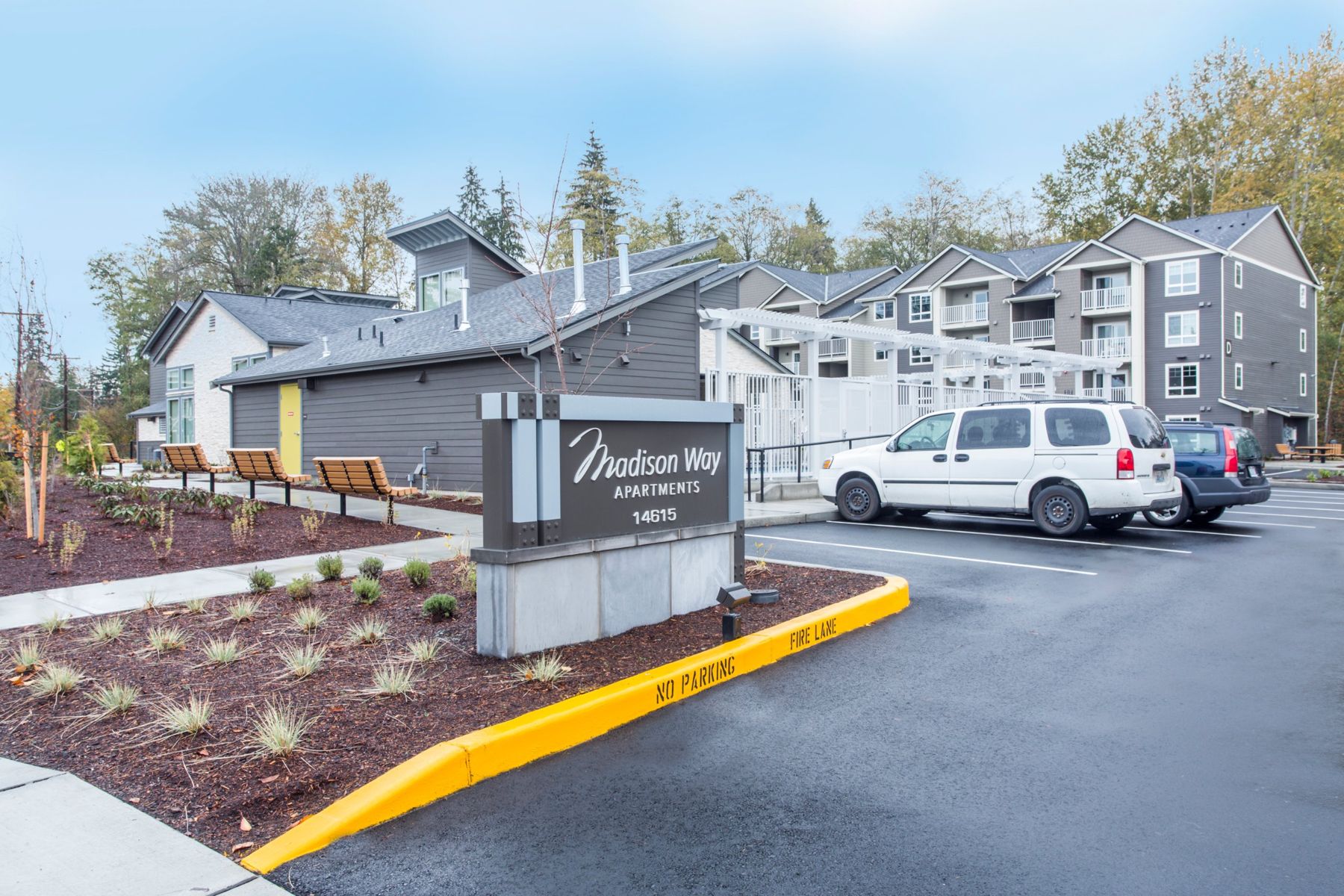Madison Way Apartments entry sign, clubhouse and four-story buildings